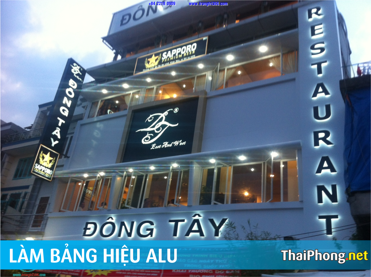 Bảng hiệu alu quán nhậu Đông Tây Restaurant